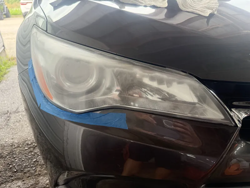 Grey Toyota Camry headlight before restoration