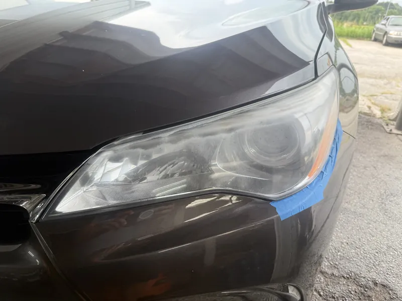 Grey Toyota Camry headlight before restoration
