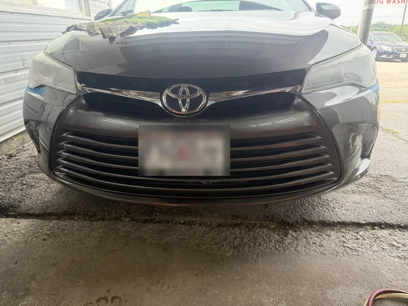 Grey Toyota Camry headlight before restoration