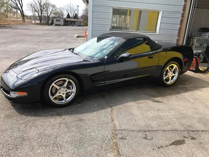 Black sports car — exterior after detailing