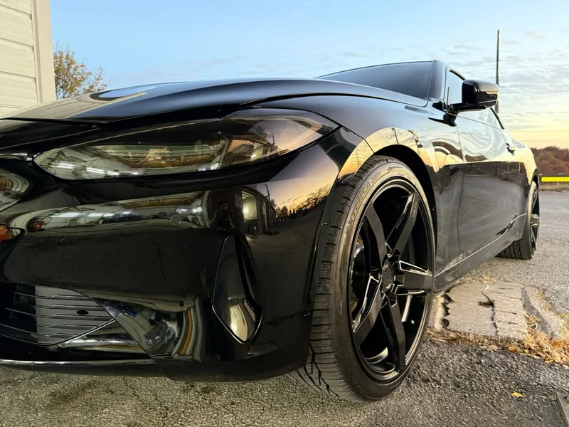 Glossy black sports car detailed to a mirror finish at Xtreme Auto Detailing