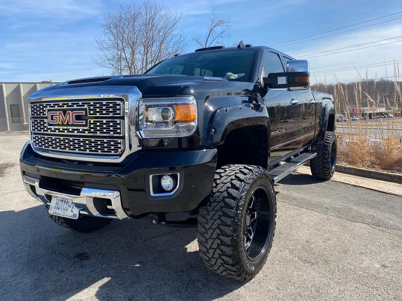 Black lifted pickup truck — exterior after detailing