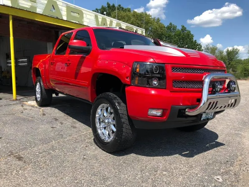 Red lifted pickup truck — exterior after detailing