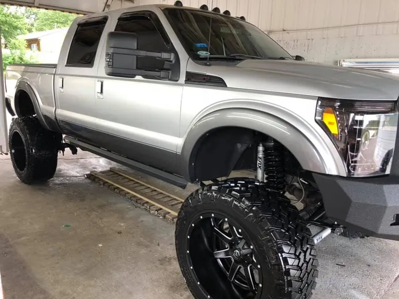 Silver lifted pickup truck — exterior after detailing
