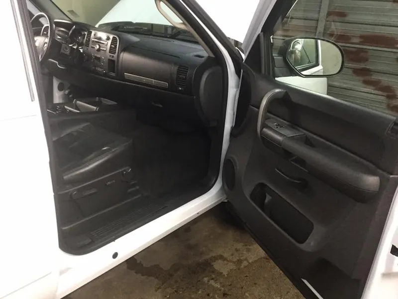 Grey pickup-truck interior — deep-clean detail (passenger dash & floor)